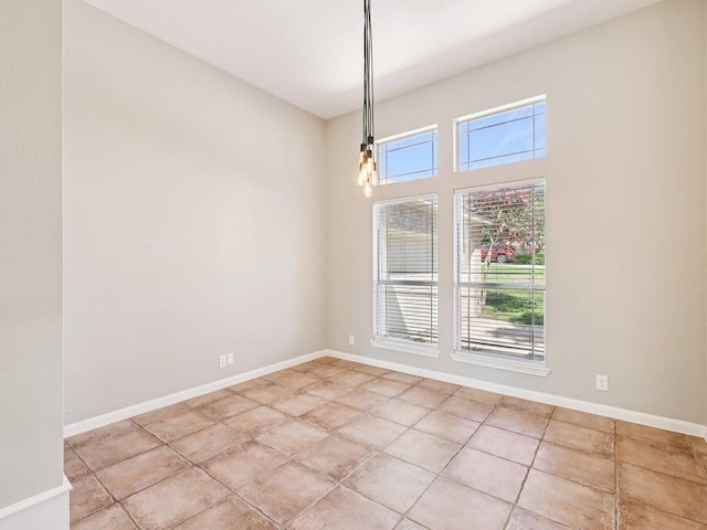 152 Acapulco Dr, Lakeway, TX 78734 - unfurnished room featuring light tile patterned floors and a chandelier