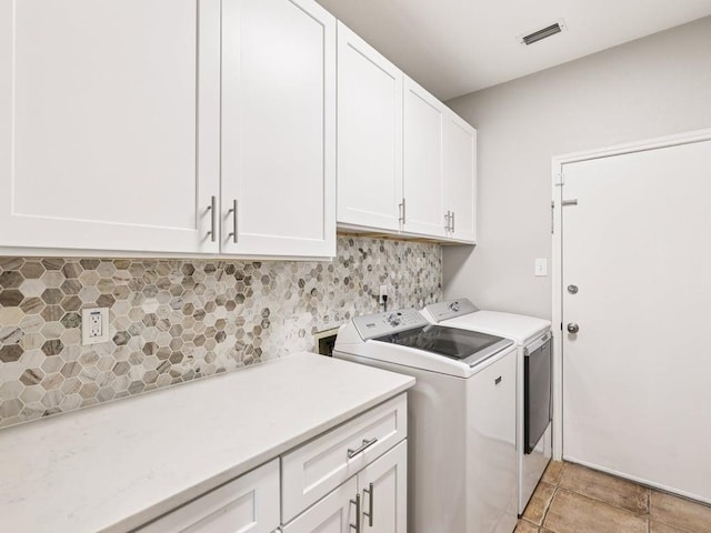 152 Acapulco Dr, Lakeway, TX 78734 - laundry room featuring cabinet space and washer and dryer