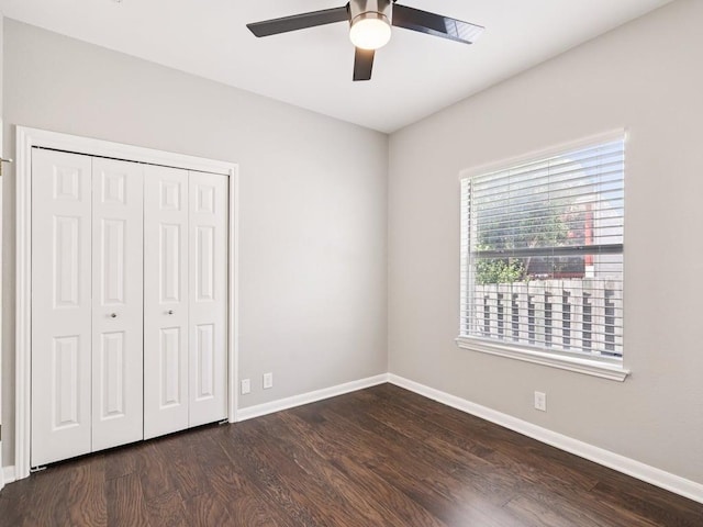 152 Acapulco Dr, Lakeway, TX 78734 - unfurnished bedroom featuring dark wood-type flooring, a closet, and a ceiling fan