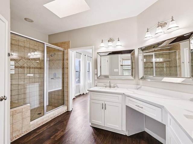 152 Acapulco Dr, Lakeway, TX 78734 - bathroom with a skylight, a shower stall, and vanity