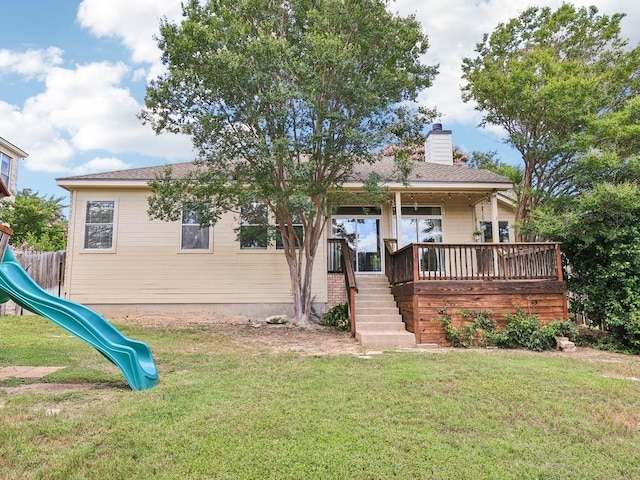 152 Acapulco Dr, Lakeway, TX 78734 - back of house featuring a yard, a playground, a chimney, and stairs