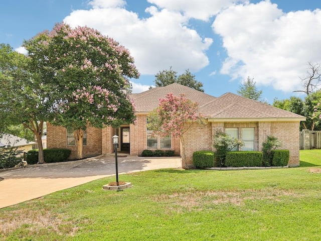 152 Acapulco Dr, Lakeway, TX 78734 - view of front of house with a front yard and driveway