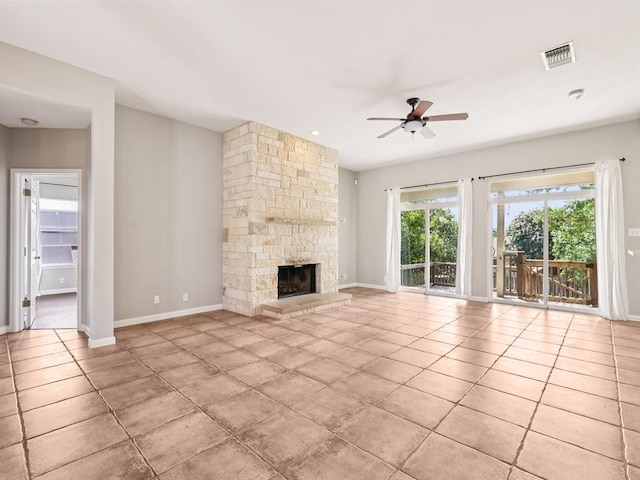 152 Acapulco Dr, Lakeway, TX 78734 - unfurnished living room with ceiling fan, tile patterned floors, and a fireplace