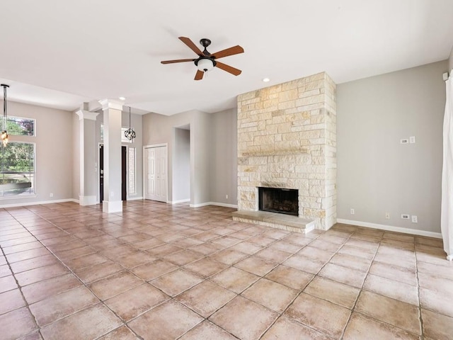 152 Acapulco Dr, Lakeway, TX 78734 - unfurnished living room with ceiling fan, tile patterned flooring, and a fireplace