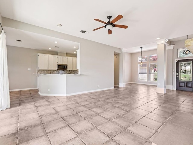 152 Acapulco Dr, Lakeway, TX 78734 - unfurnished living room with recessed lighting, ceiling fan, and light tile patterned floors