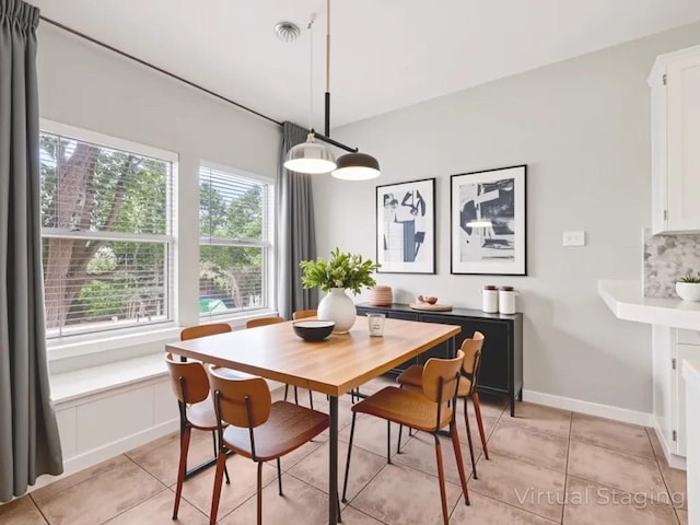 152 Acapulco Dr, Lakeway, TX 78734 - dining space with light tile patterned floors and baseboards