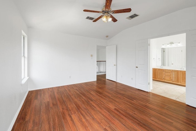 1505 Thibodeaux Dr, Round Rock, TX 78664 - unfurnished bedroom with vaulted ceiling, light wood-style flooring, a ceiling fan, and ensuite bathroom