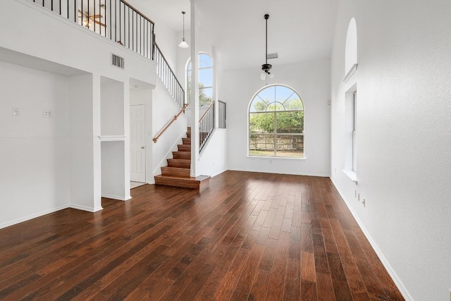 1505 Thibodeaux Dr, Round Rock, TX 78664 - foyer with wood-type flooring, a high ceiling, and stairs