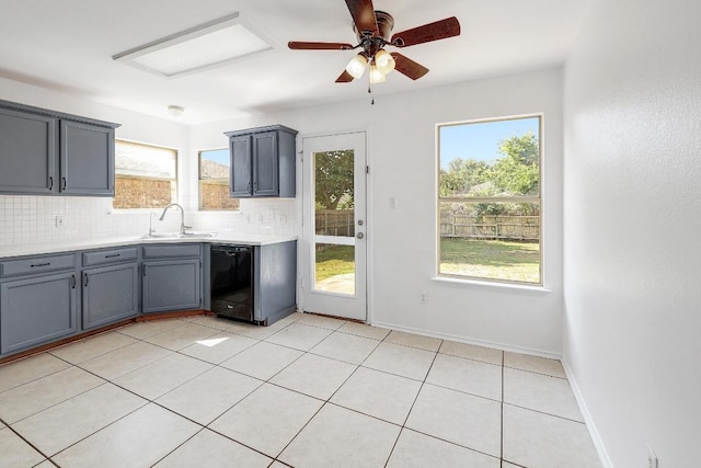 1505 Thibodeaux Dr, Round Rock, TX 78664 - kitchen featuring dishwasher, tasteful backsplash, gray cabinets, light countertops, and a ceiling fan