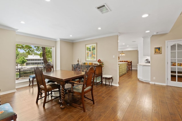 1005 Terry Ln, Kingsland, TX 78639 - dining space with wood finished floors, recessed lighting, and ornamental molding