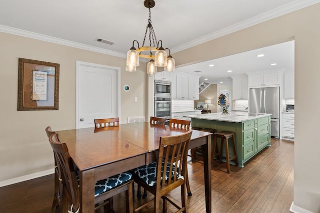 1005 Terry Ln, Kingsland, TX 78639 - dining room featuring dark wood finished floors, ornamental molding, a chandelier, and recessed lighting