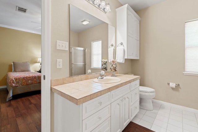 1005 Terry Ln, Kingsland, TX 78639 - ensuite bathroom with vanity, an enclosed shower, and plenty of natural light