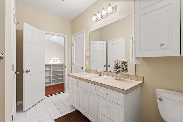 1005 Terry Ln, Kingsland, TX 78639 - bathroom featuring vanity, tile patterned floors, and a chandelier