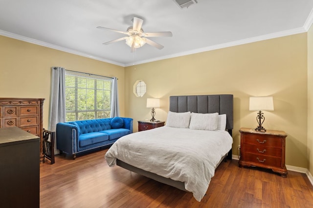 1005 Terry Ln, Kingsland, TX 78639 - bedroom with dark wood-style floors, crown molding, and a ceiling fan