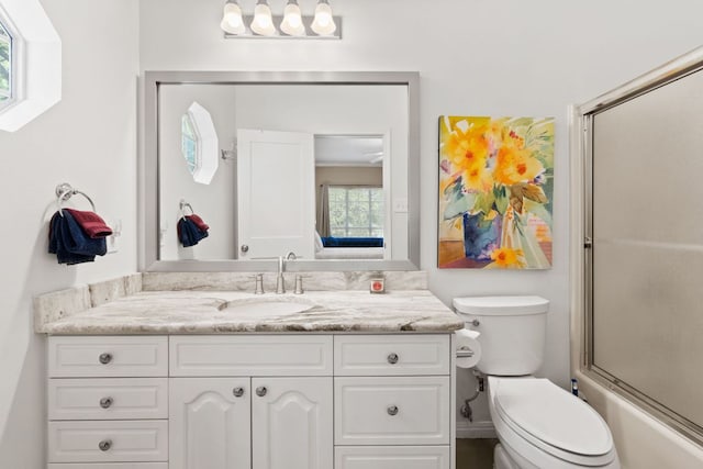 1005 Terry Ln, Kingsland, TX 78639 - bathroom featuring vanity and combined bath / shower with glass door