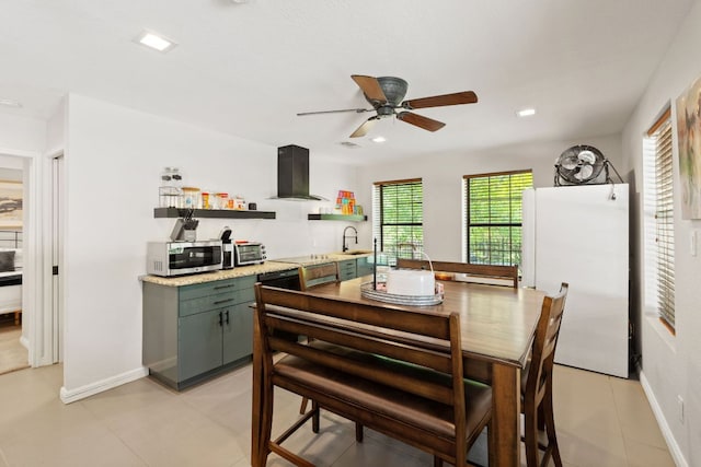 1005 Terry Ln, Kingsland, TX 78639 - dining room with ceiling fan, light tile patterned flooring, and recessed lighting