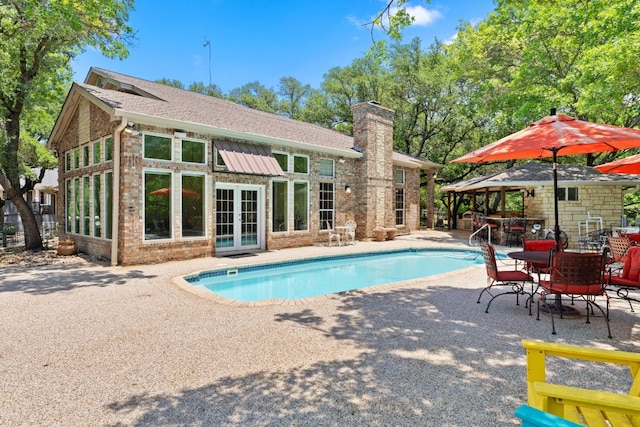 1005 Terry Ln, Kingsland, TX 78639 - outdoor pool featuring french doors and a patio area