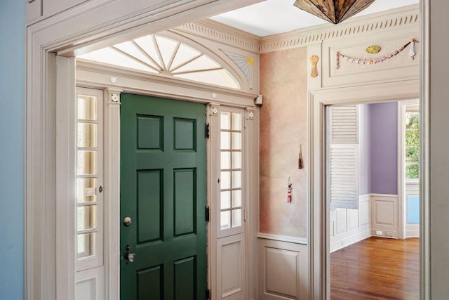 3201 W Ave, Austin, TX 78705 - entryway with a decorative wall, a wainscoted wall, wood finished floors, and crown molding
