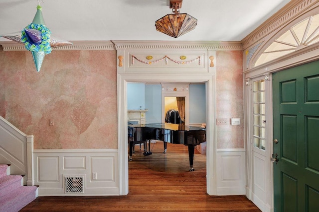 3201 W Ave, Austin, TX 78705 - foyer featuring a decorative wall, wainscoting, wood finished floors, and stairway