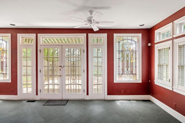3201 W Ave, Austin, TX 78705 - doorway with plenty of natural light, french doors, a ceiling fan, and dark tile patterned flooring