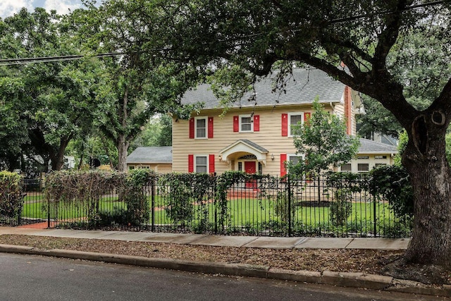 3201 W Ave, Austin, TX 78705 - colonial-style house with a fenced front yard and a shingled roof