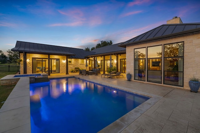 196 Westgate Loop, Horseshoe Bay, TX 78657 - view of swimming pool with a patio area, an outdoor hangout area, and a pool with connected hot tub
