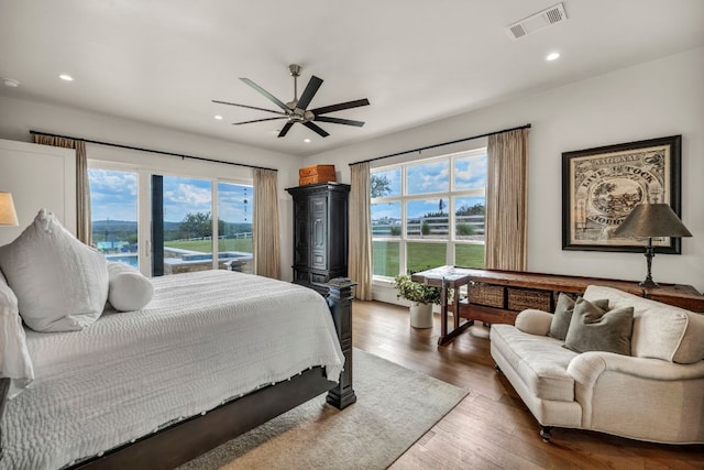 196 Westgate Loop, Horseshoe Bay, TX 78657 - bedroom with wood finished floors, recessed lighting, and a ceiling fan
