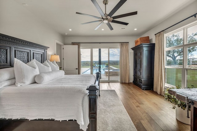 196 Westgate Loop, Horseshoe Bay, TX 78657 - bedroom featuring access to outside, wood finished floors, recessed lighting, and a ceiling fan