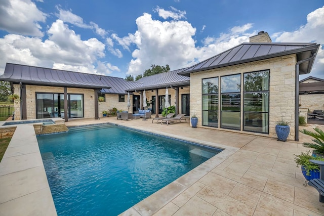 196 Westgate Loop, Horseshoe Bay, TX 78657 - view of pool featuring a patio area, an outdoor living space, and a pool with connected hot tub