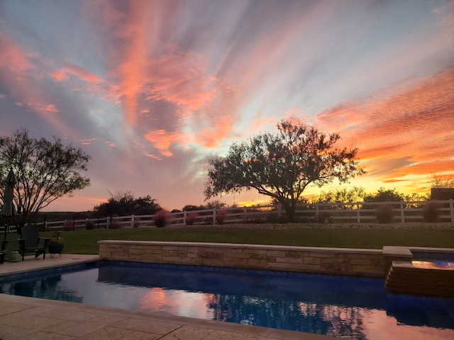 196 Westgate Loop, Horseshoe Bay, TX 78657 - pool at dusk with a fenced backyard