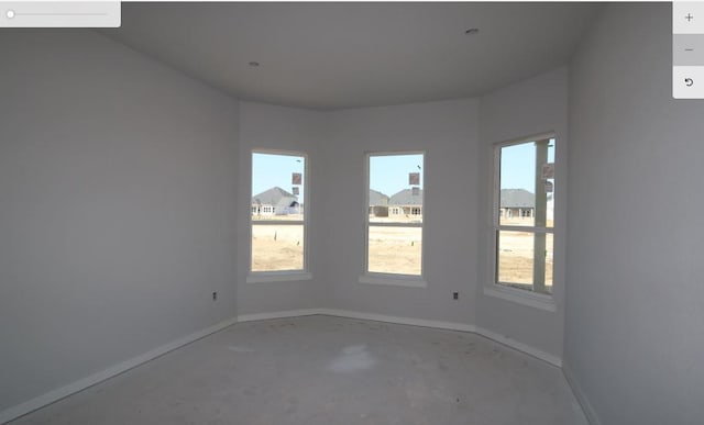 2024 Saco St, Leander, TX 78641 - empty room with baseboards and unfinished concrete flooring
