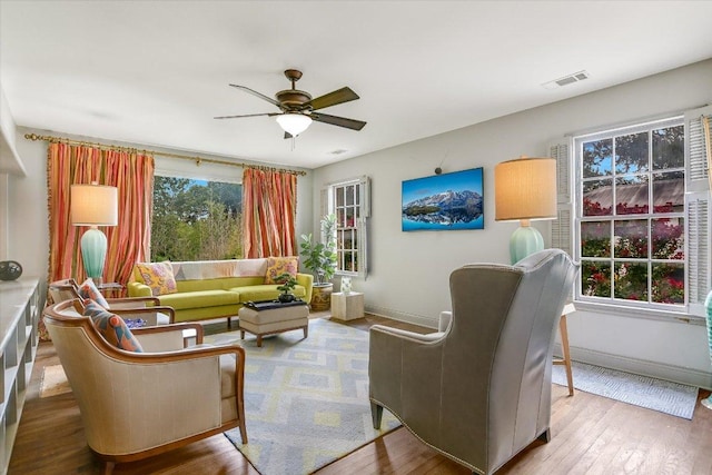 1410 Burford Pl, Austin, TX 78704 - living room featuring a ceiling fan and wood finished floors
