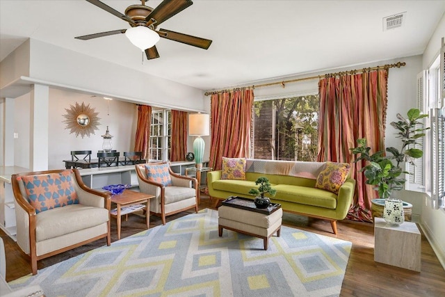 1410 Burford Pl, Austin, TX 78704 - living room with plenty of natural light, wood finished floors, and a ceiling fan