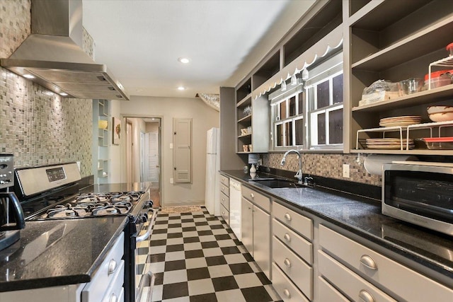 1410 Burford Pl, Austin, TX 78704 - kitchen with appliances with stainless steel finishes, wall chimney range hood, open shelves, decorative backsplash, and recessed lighting
