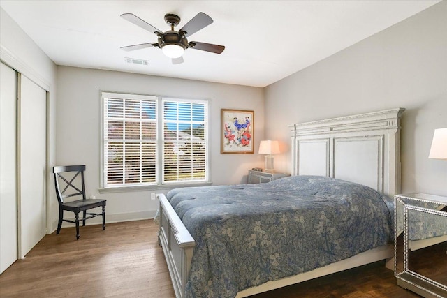 1410 Burford Pl, Austin, TX 78704 - bedroom featuring wood finished floors, ceiling fan, and a closet
