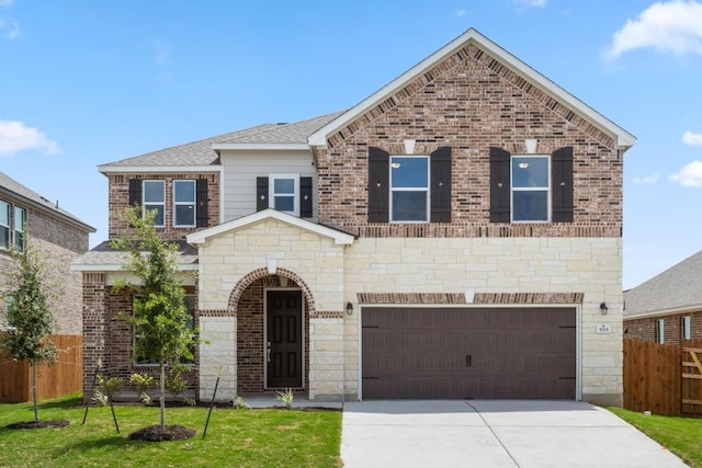 3715 Liberi Ln, Round Rock, TX 78665 - view of front of home with an attached garage, driveway, and stone siding