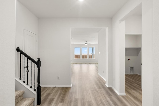 3715 Liberi Ln, Round Rock, TX 78665 - hall featuring light wood-style flooring and stairs