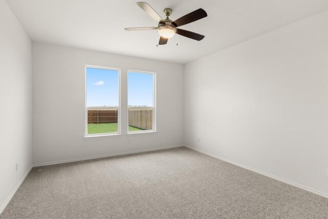3715 Liberi Ln, Round Rock, TX 78665 - carpeted empty room with baseboards and a ceiling fan