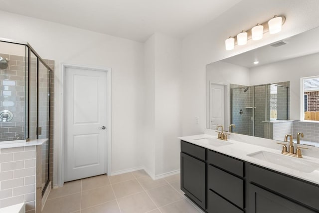 3715 Liberi Ln, Round Rock, TX 78665 - full bathroom featuring double vanity, a stall shower, and tile patterned flooring