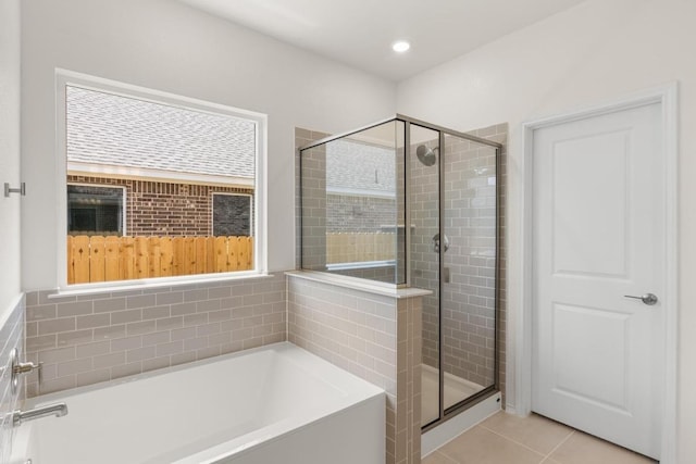 3715 Liberi Ln, Round Rock, TX 78665 - full bath with a garden tub, a shower stall, tile patterned flooring, and recessed lighting