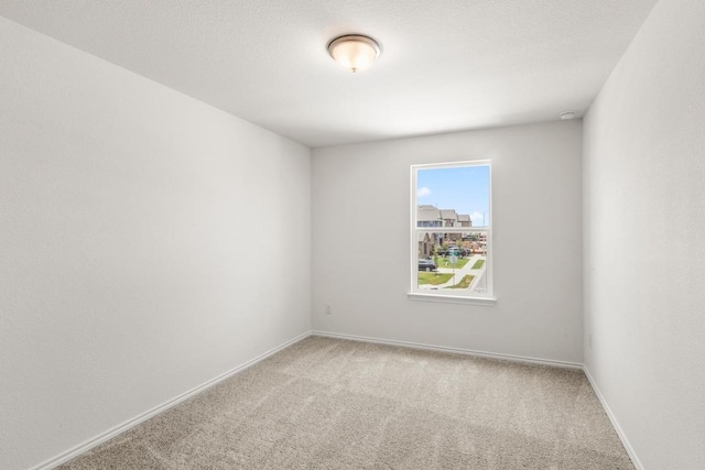 3715 Liberi Ln, Round Rock, TX 78665 - carpeted empty room with baseboards and a smoke detector