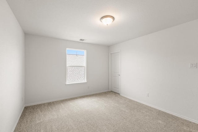 3715 Liberi Ln, Round Rock, TX 78665 - spare room featuring light carpet