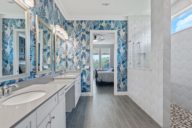306 Iron Rail Ln, Georgetown, TX 78633 - full bathroom with wallpapered walls, ensuite bath, double vanity, ornamental molding, and a walk in shower