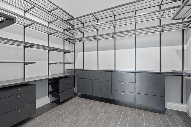 306 Iron Rail Ln, Georgetown, TX 78633 - walk in closet featuring wood tiled floors
