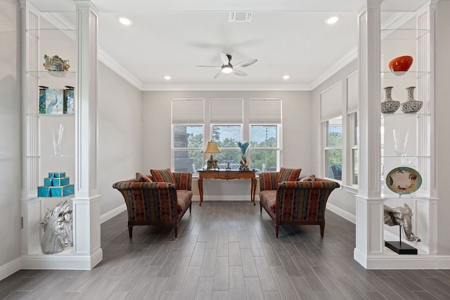 306 Iron Rail Ln, Georgetown, TX 78633 - living area featuring wood finished floors, ornate columns, a ceiling fan, ornamental molding, and recessed lighting