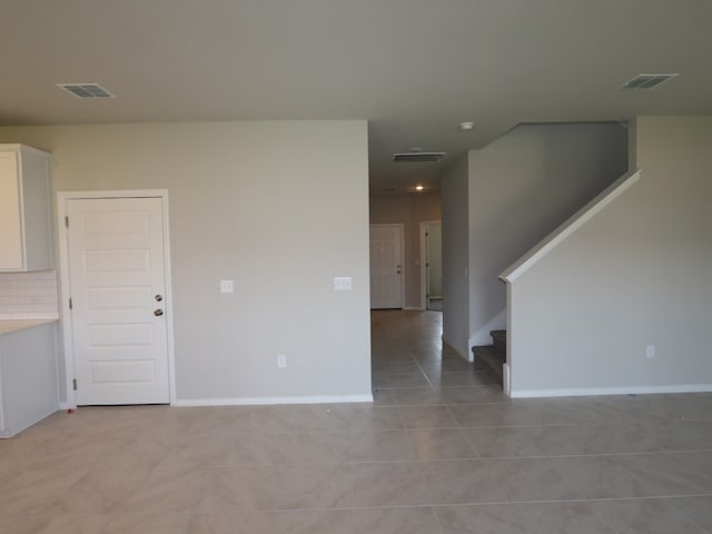 4916 Sea Salt Dr, Austin, TX 78747 - spare room featuring stairs and light tile patterned flooring