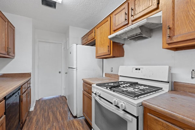 12323 Alderbrook Dr, Austin, TX 78758 - kitchen featuring white appliances, under cabinet range hood, dark wood finished floors, brown cabinetry, and a textured ceiling