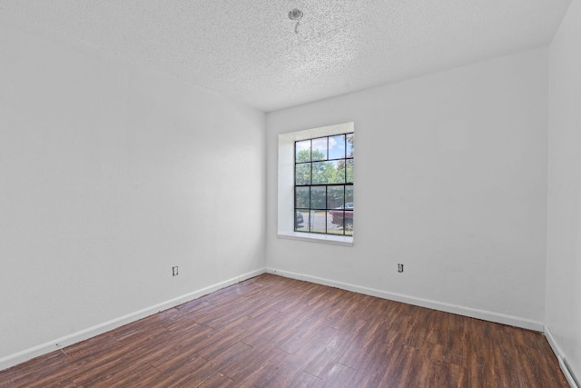 12323 Alderbrook Dr, Austin, TX 78758 - spare room with wood finished floors and a textured ceiling
