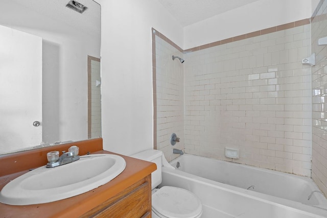 12323 Alderbrook Dr, Austin, TX 78758 - full bathroom featuring vanity, tub / shower combination, and a textured ceiling