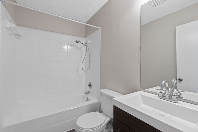 12323 Alderbrook Dr, Austin, TX 78758 - bathroom with a textured ceiling, tub / shower combination, and vanity